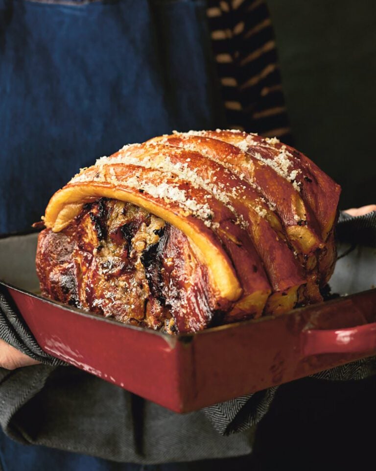 Slow-cooked pork shoulder stuffed with orange and prunes
