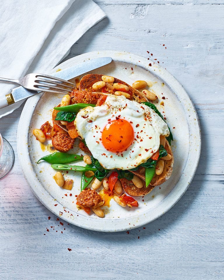 Beans and greens on toast with chorizo and egg